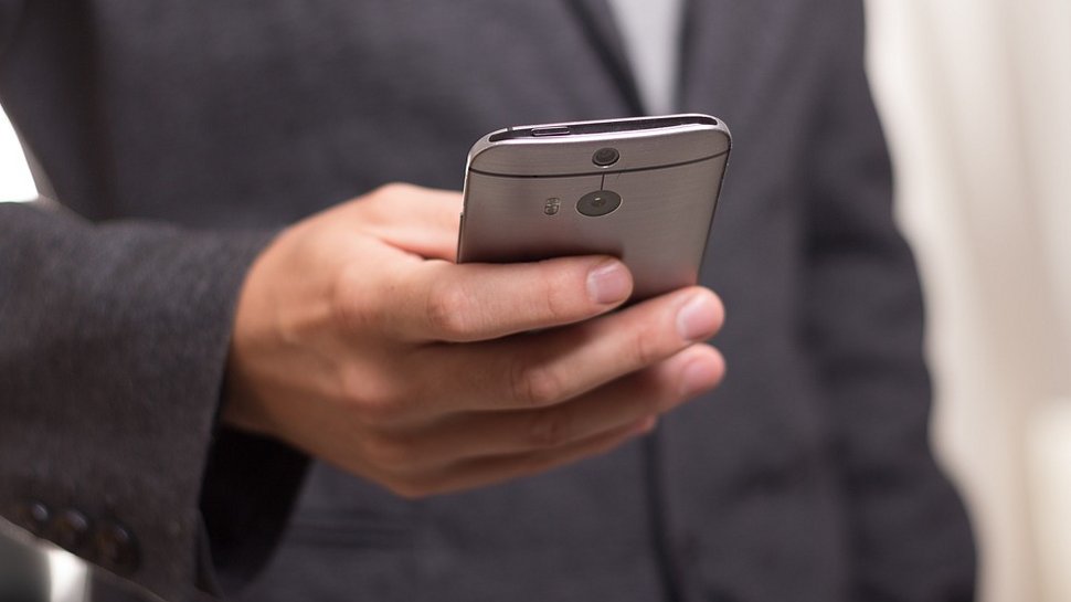 Close -up of a businessman using a smartphone.