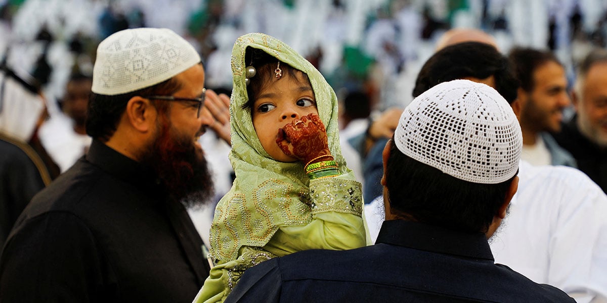 A girl looks as the worshipers attend the prayer of Eid at the Stadium of Education, in Al Rayyan, Qatar, March 30, 2025. - Reuters