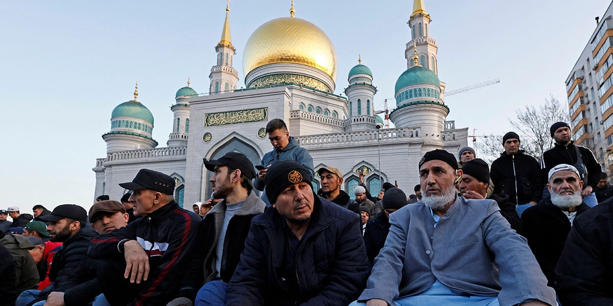 The faithful attend the prayer of Eid outside the cathedral mosque in Moscow, Russia, March 30, 2025. - Reuters