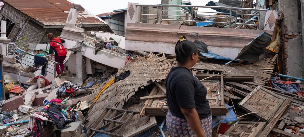 A woman in Mandalay, Myanmar, looks at the devastation caused by the earthquake.