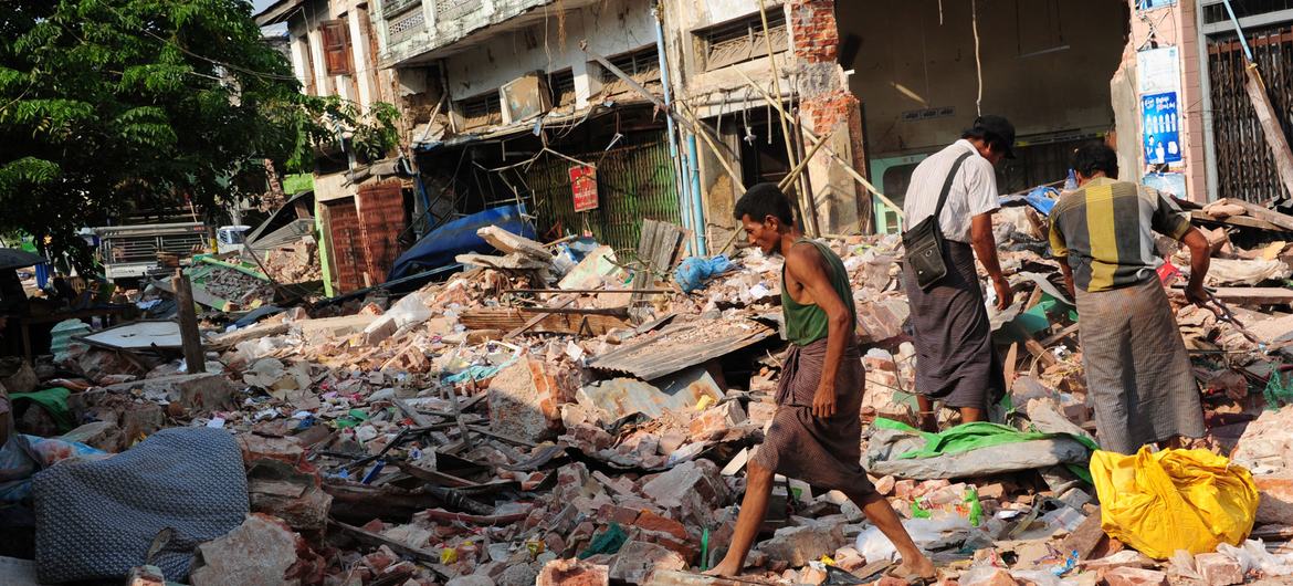 The survivors of the earthquake study the ruins of their houses in Pyinmana, Myanmar, after the earthquake there. The survivors of the earthquake study the ruins of their houses in Pyinmana, Myanmar, after the earthquake there.