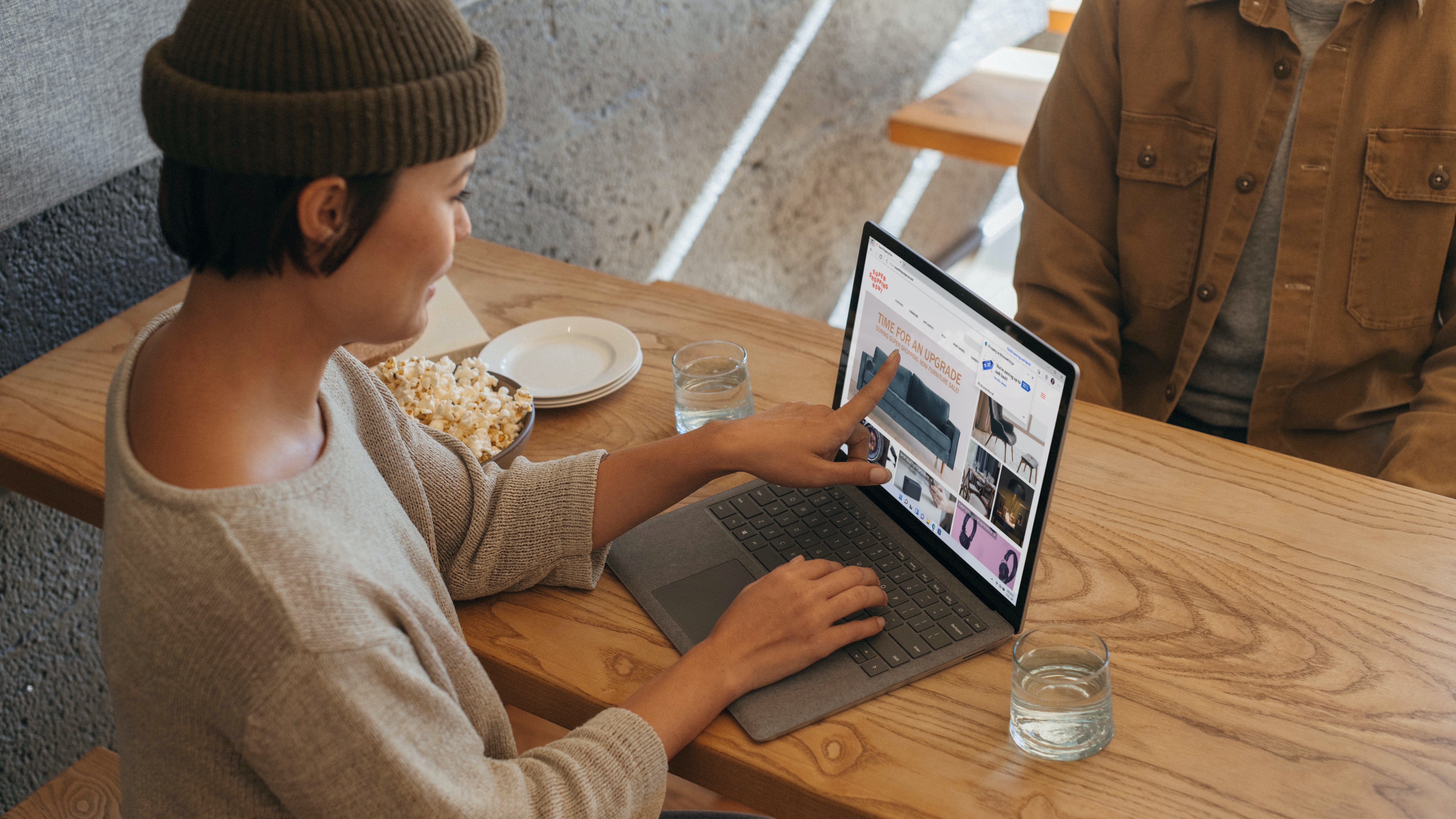 Woman using Windows 11 computer with Microsoft Edge
