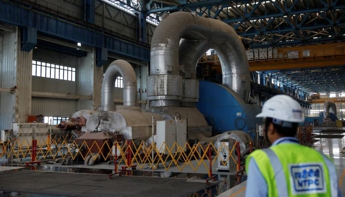An employee is seen inside the NTPC power plant (National Thermal Power Corporation) in Solapur, India, March 2, 2025. - Reuters
