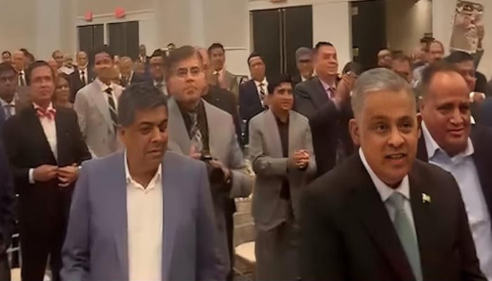 Members of the Pakistani community in the United States give a standing ovation to Marshal Syed Asim Munir. - ISPR