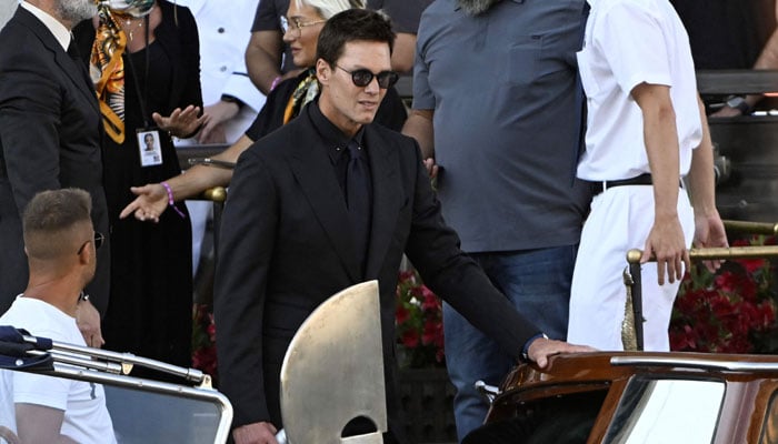 American football player Tom Brady leaves the Gritti Palace Hotel on the Wedding Day of the founder of Amazon Jeff Bezos with Lauren Sanchez, in Venice on June 27, 2025. - AFP