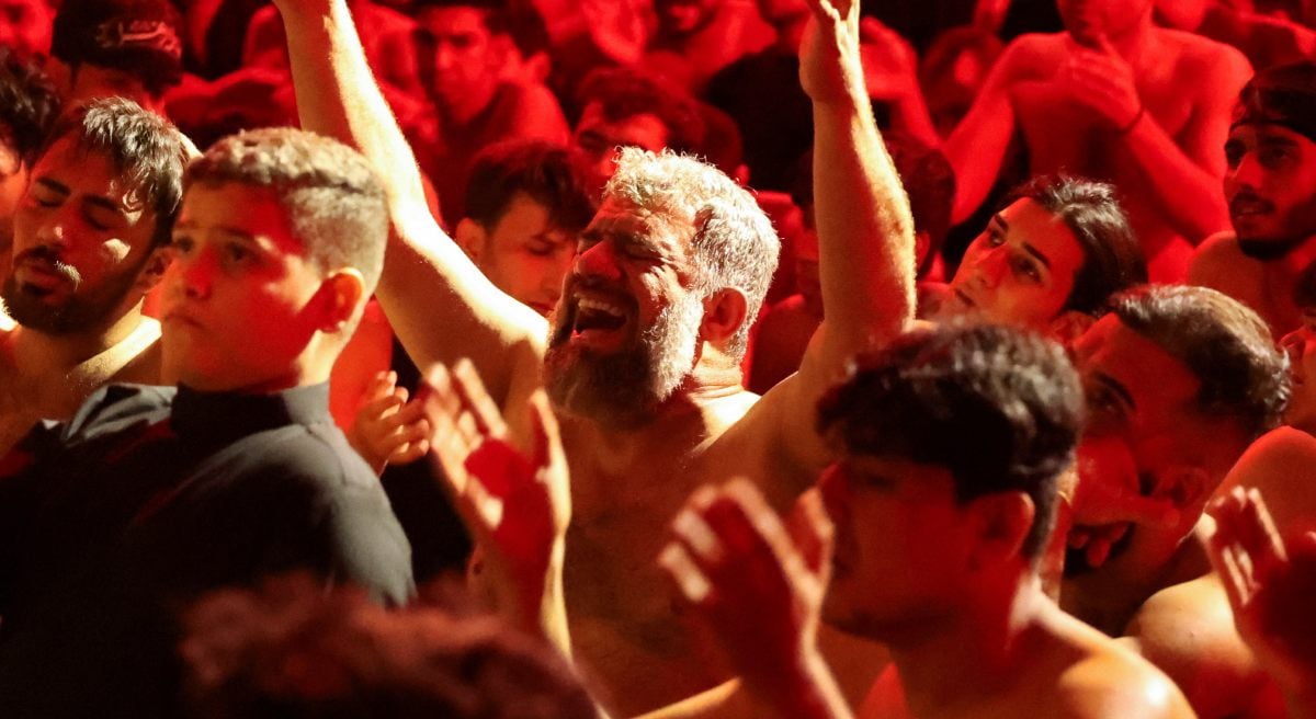 The mourning people beat their chest during a marking ashura religious ritual in Baghdad, Iraq, July 6, 2025. - Reuters
