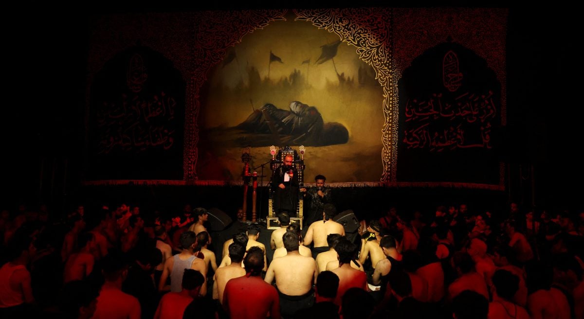 The mourning people listen to a religious recite during a gathering of mourning marking Ashura in Baghdad, Iraq, July 6, 2025. - Reuters