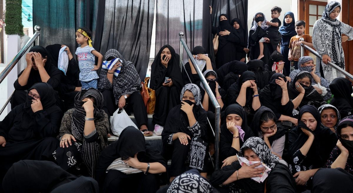 Women cry during the commemoration of Ashura in New Delhi, India, July 6, 2025 - Reuters