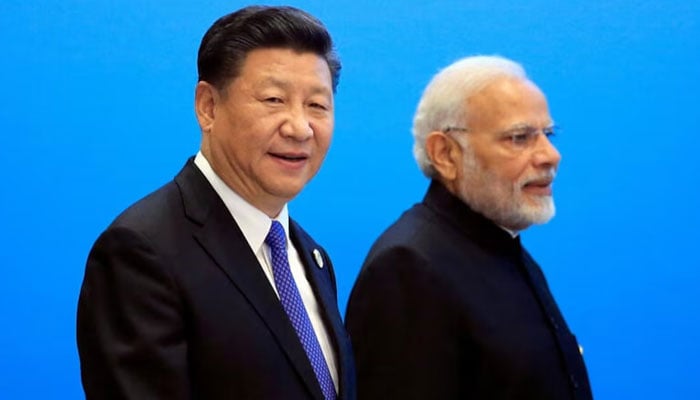 The president of Chinas Xi Jinping and the Prime Minister of Indias Narendra Modi arrive for a signature ceremony at the OCS summit in Qingdao, Shandong, China. - Reuters / File
