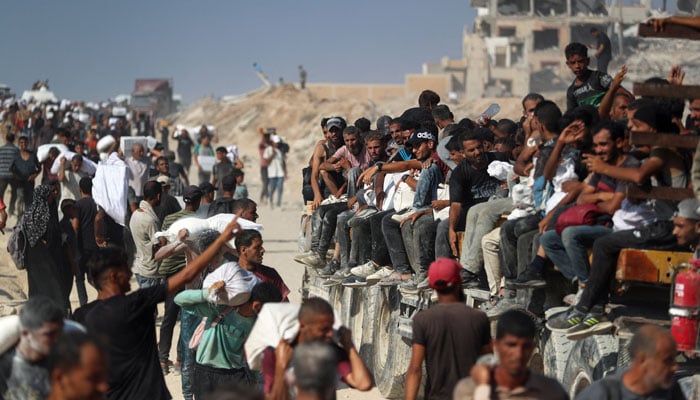 The Palestinians transport aid supplies that have entered Gaza by Israel, Beit Lahia, Northern Gaza Strip, August 2, 2025. - Reuters