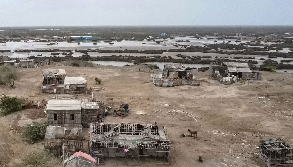The abandoned houses are represented in one of the villages in the city of Kharo Chan, in the Inda delta on June 25, 2025. - AFP