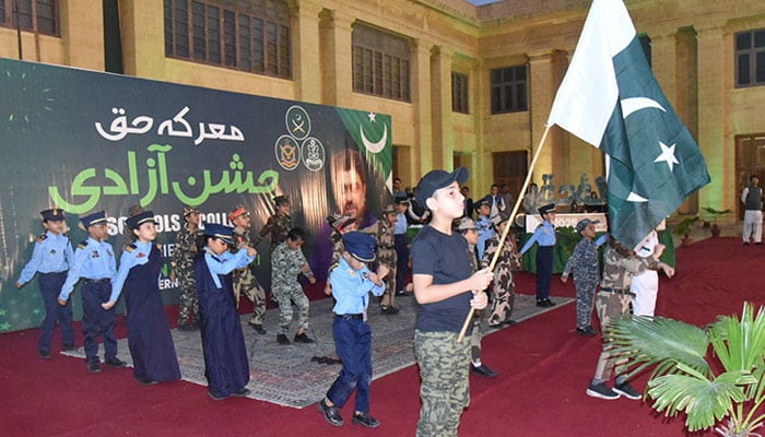 Performance of school students during Marka E Haq, independence celebrations at Governor House. - Application