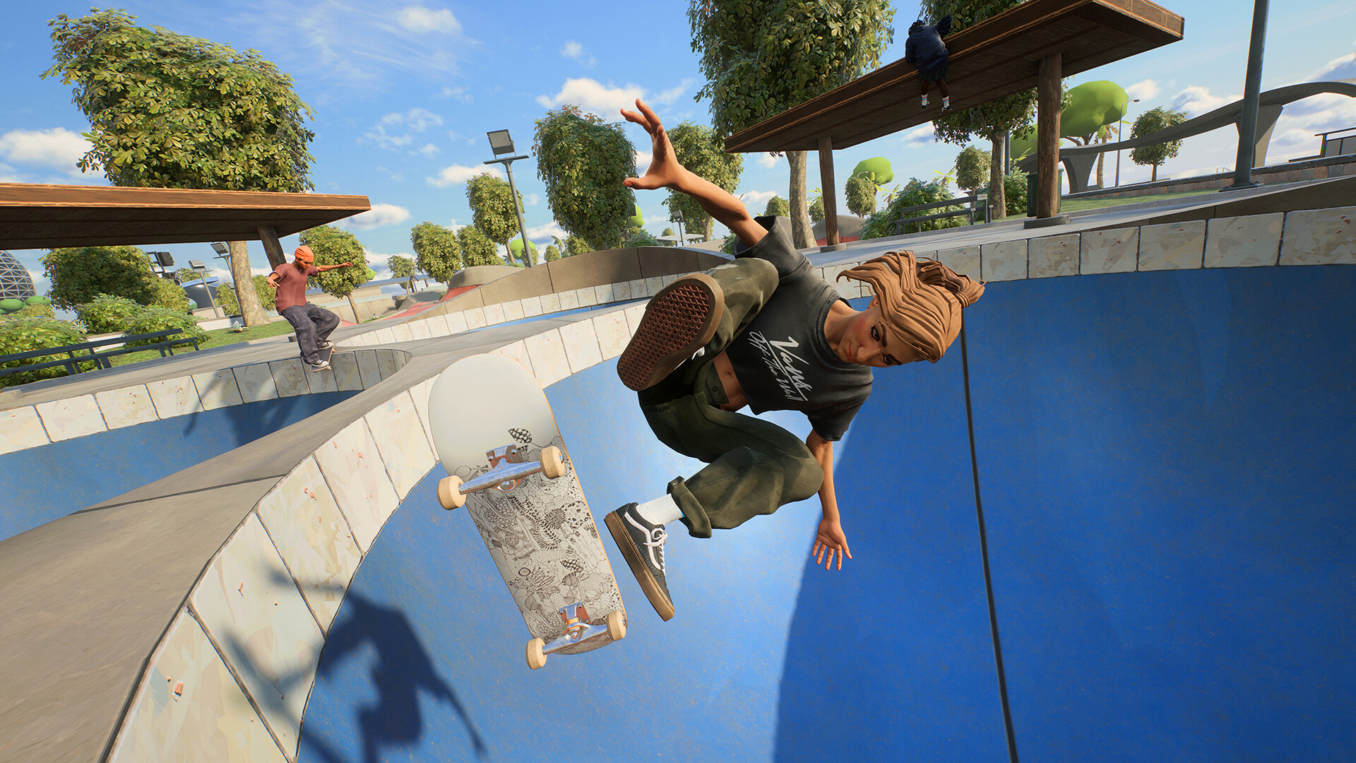 A skater performs a flip tour at the top of a bowl