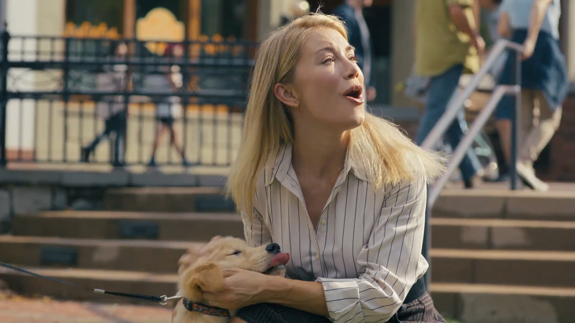 Emilia Harcourt 2 caressing a puppy in Peacemaker Season 2 Episode 3