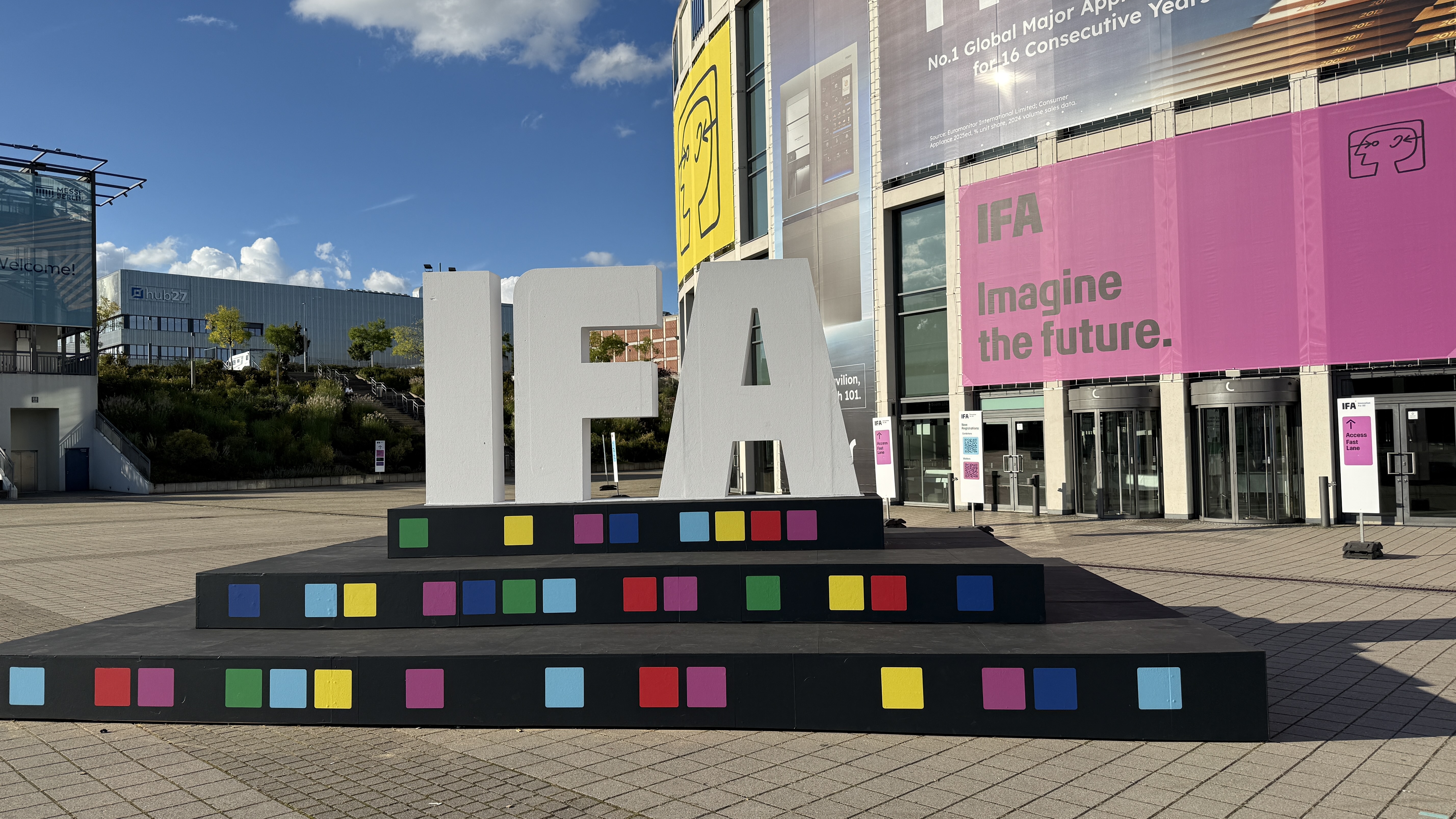 A sign of the IFA logo, with the Berlin Mass complex in the background