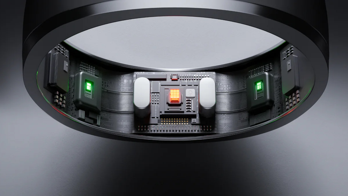 The internal components of the Ringconn Smart Ring Gen 2 on a gray background