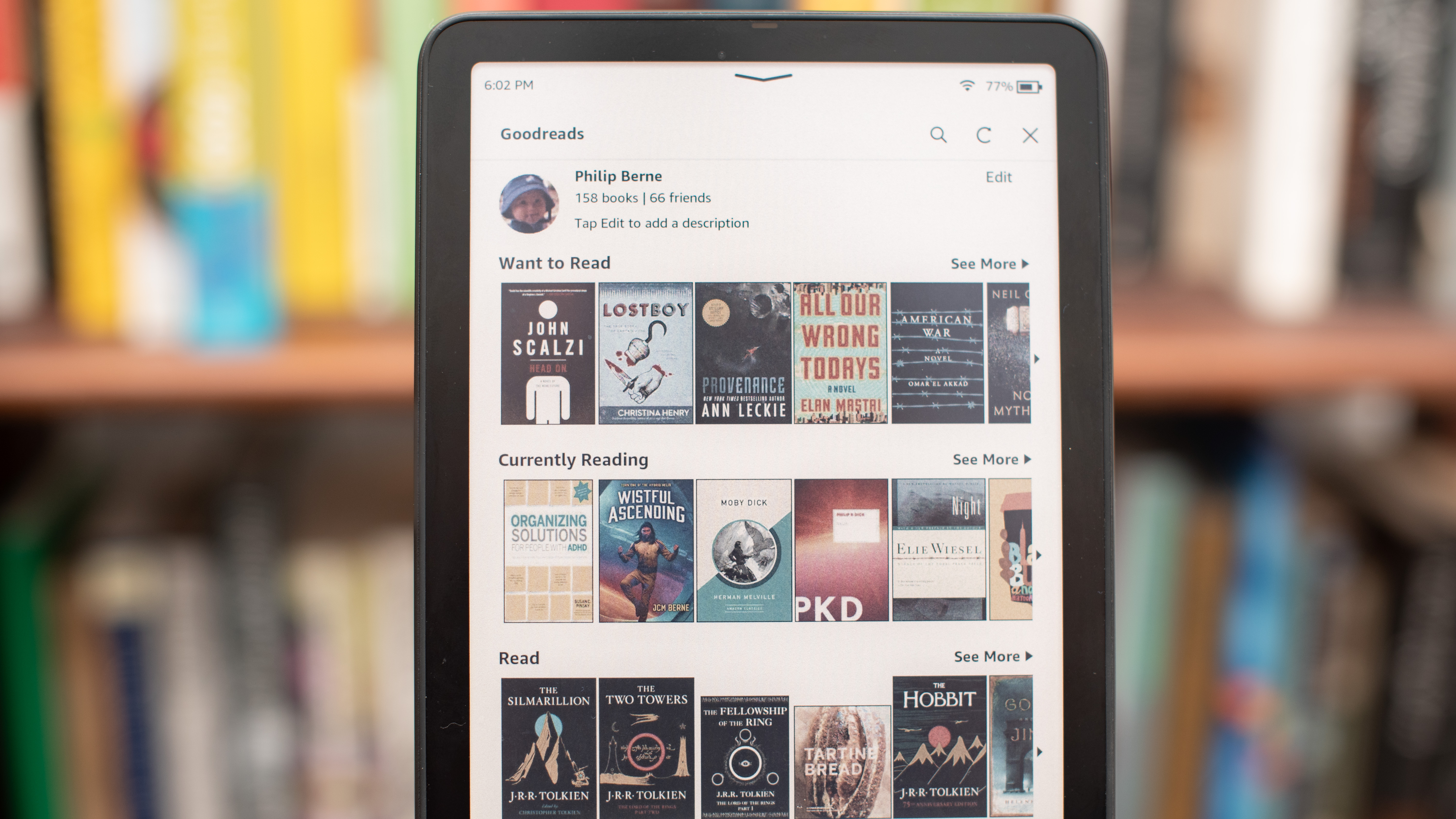 Electronic reader Amazon Kindle Colorsoft Signature Edition showing graphic novels, cooking and fiction books, as well as settings