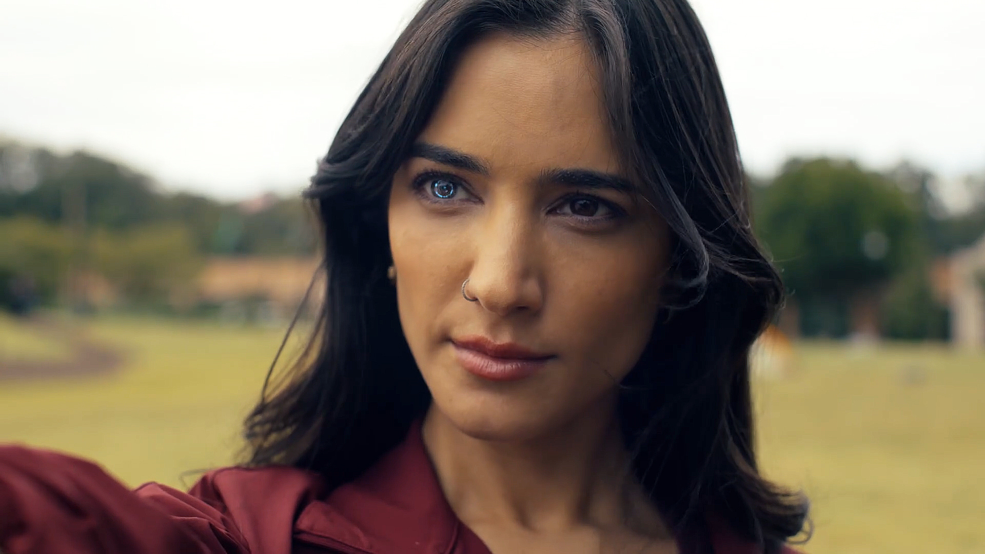 Sasha burgundy with his right robotic eye activated in Peacemaker Season 2 Episode 5
