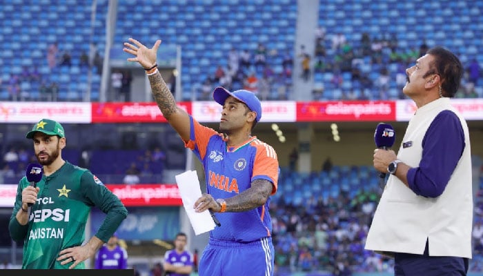 The Pakistanal skipper Salman Ali Agha (left) and the captain of India Suryakumar Yadav (Center) in the match Toss for Asia Cup 2025s Super Fours at the Dubai International Cricket Stadium, Dubai, United Arab Emirates, September 21, 2025.
