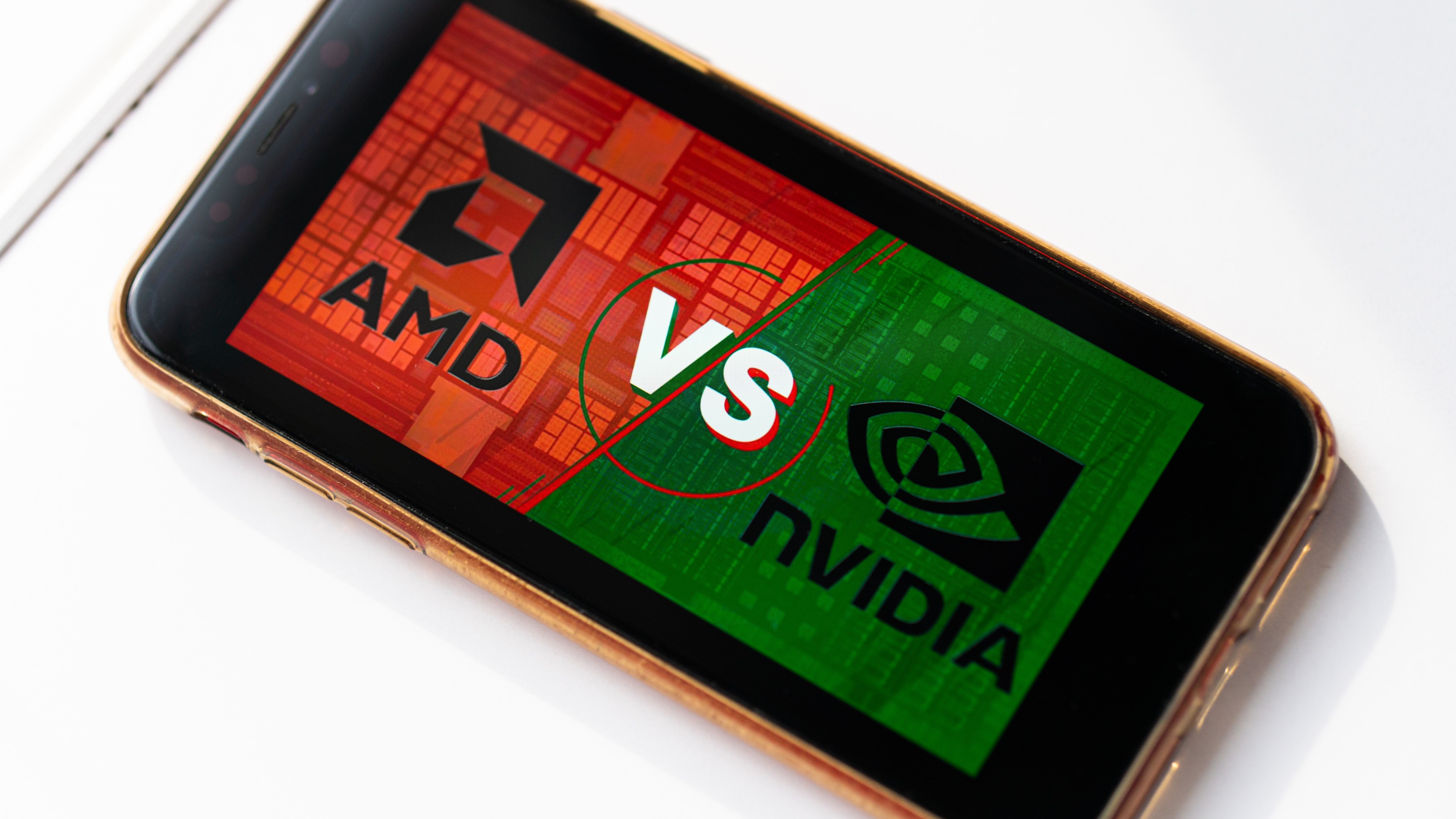 A smartphone showing a red and green graphic from & # 039; AMD vs nvidia & # 039;.