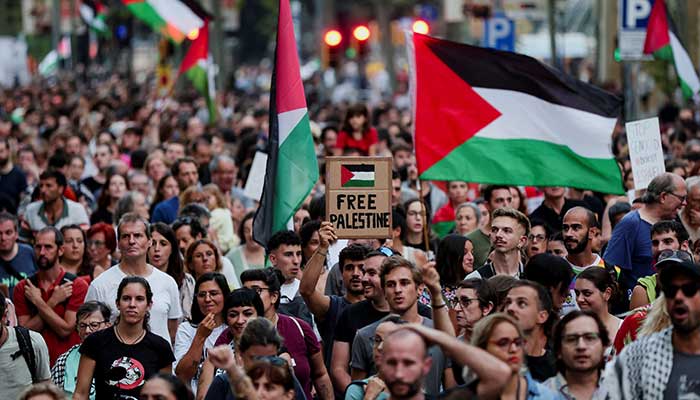 A demonstrator occupies a panel reading free Palestine during a demonstration in support of the Palestinians, in Barcelona, ​​Spain, September 18, 2025. - Reuters