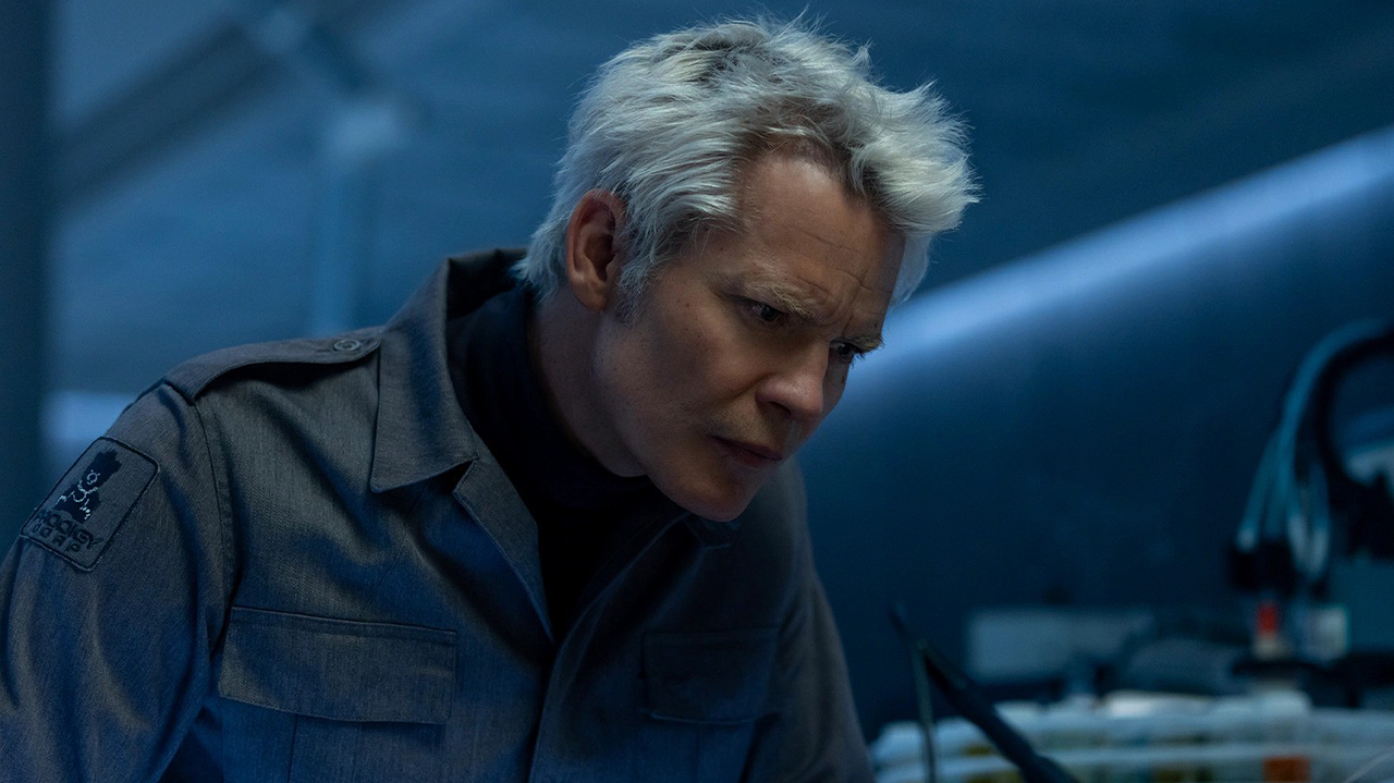 Kirsh leaning on a table in Alien: Earth Season 1 Episode 8