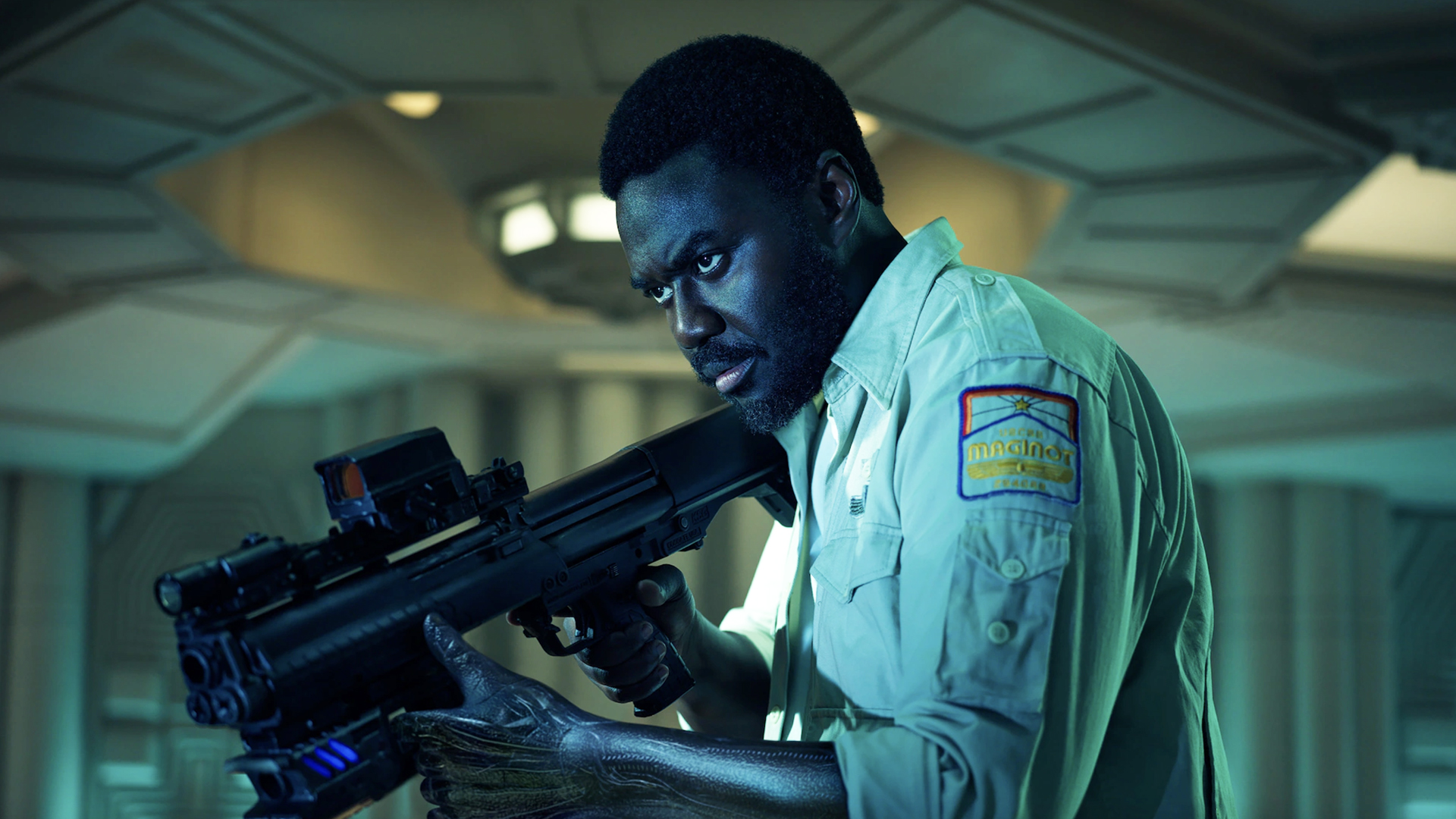 Morrow brandishing a rifle in Alien: earth