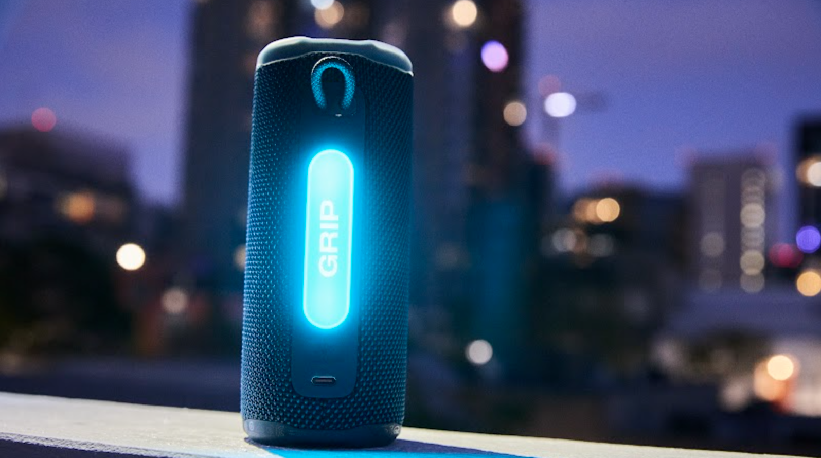 Jbl grip in front of a horizon line, showing its illuminated ambient light panel
