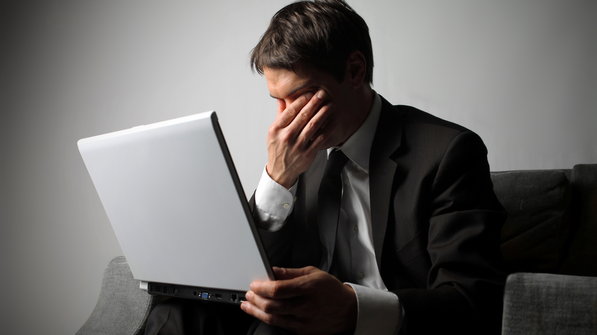 Sad businessman and laptop