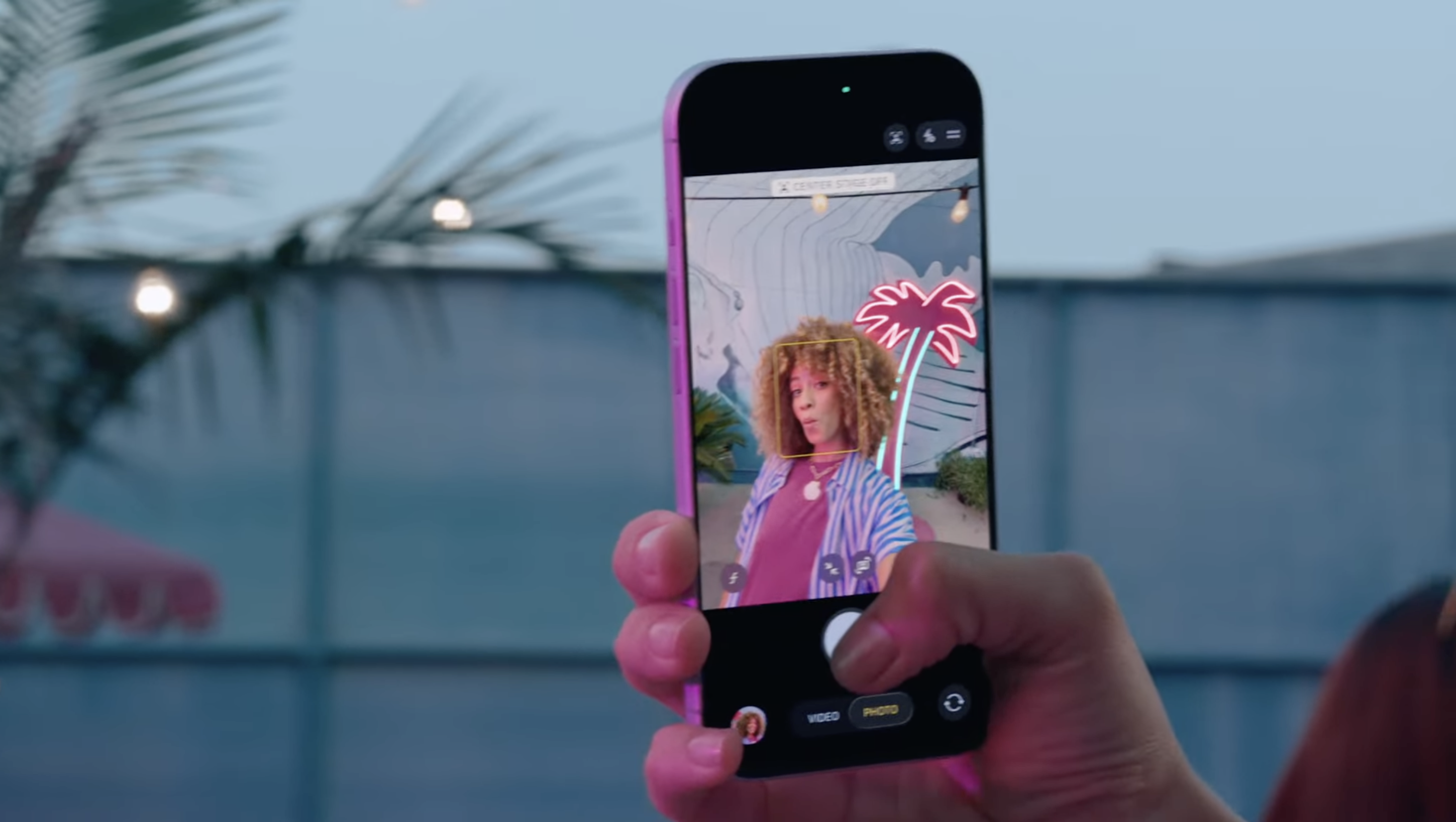 An image of a woman using the new selfie iPhone 17 camera