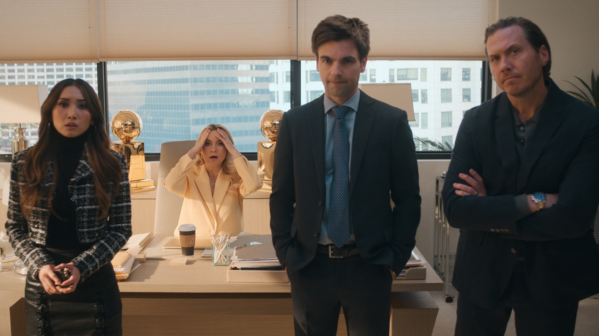 Isla and her team are in her office at Running Point