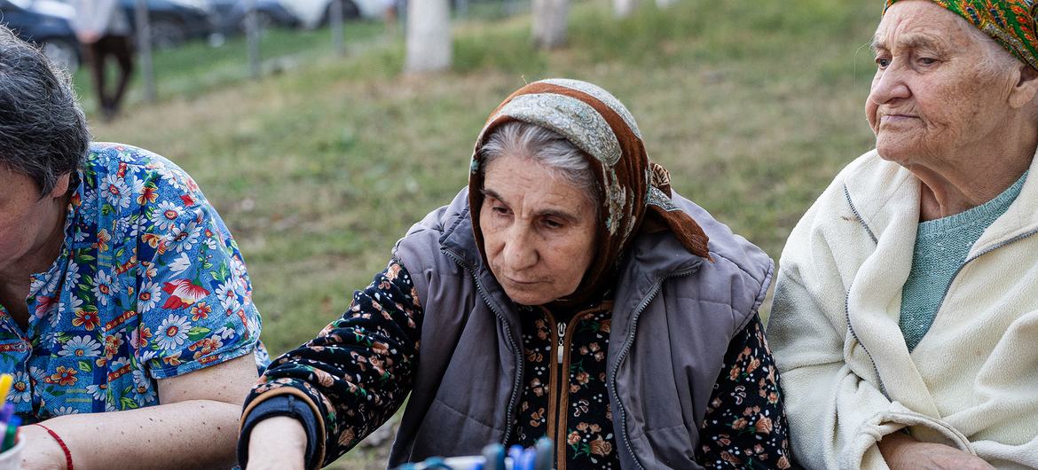 Ana (center) sits alongside other elderly women who sought support in the center of Chișinău. Ana (center) sits alongside other elderly women who sought support in the center of Chișinău.