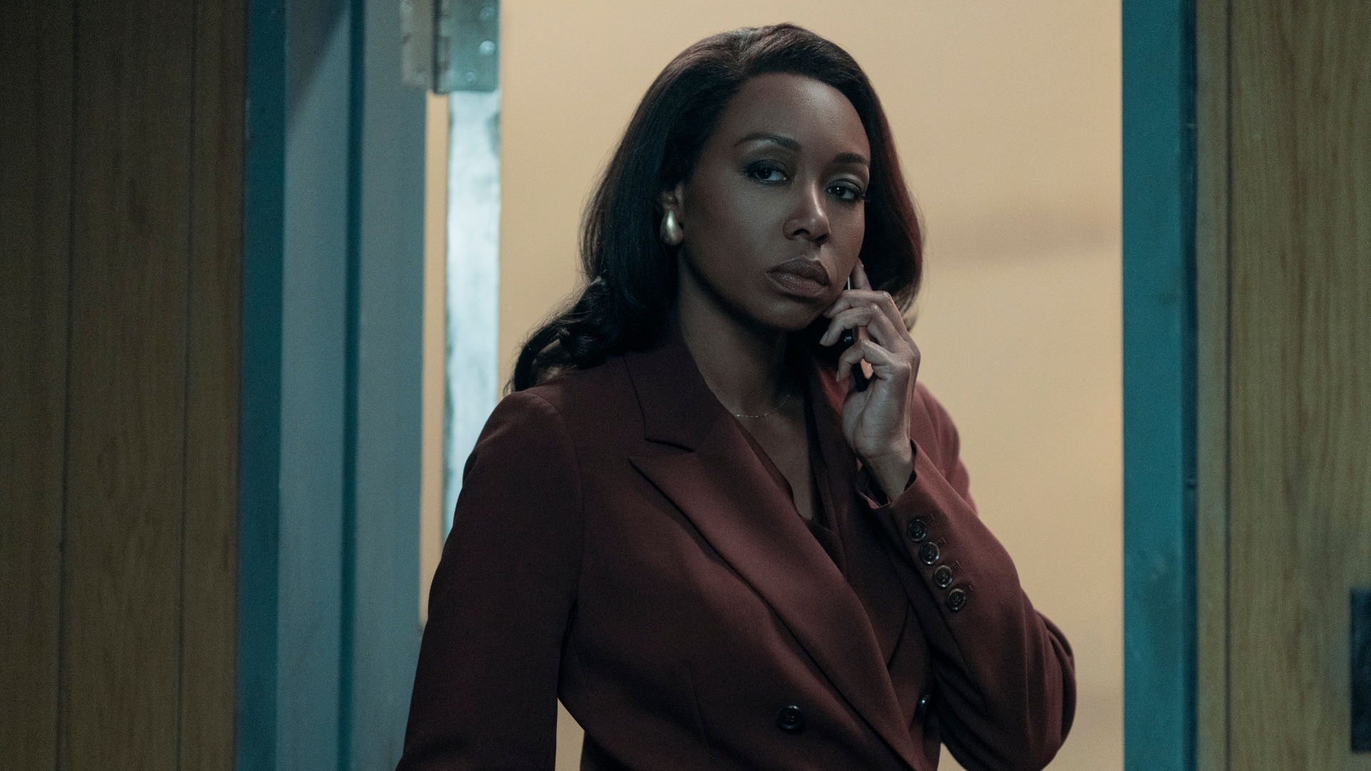 Catherine speaks on the phone in The Night Agent