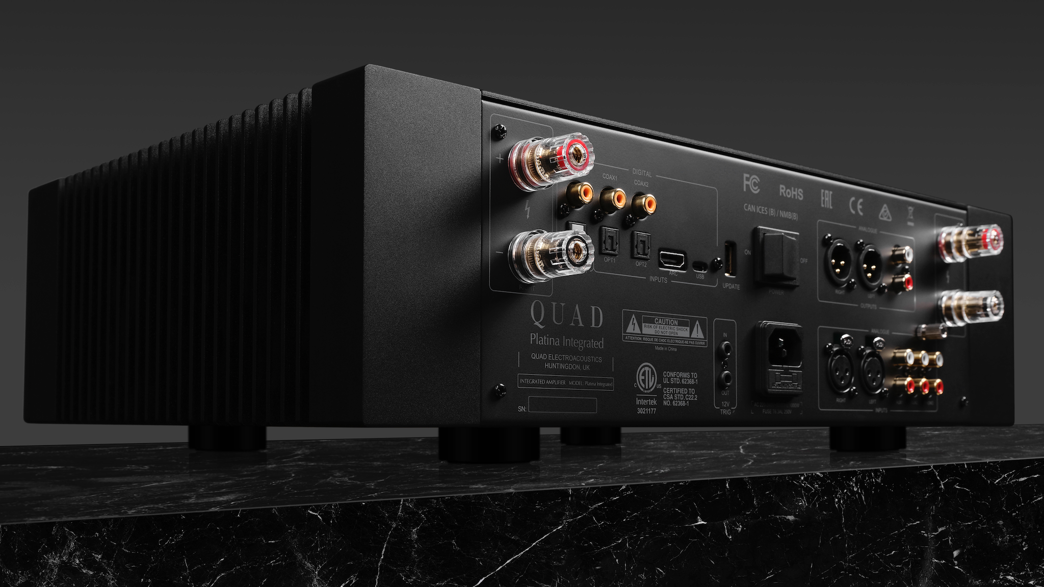 Rear view of Quad Platina integrated amplifier on dark gray background