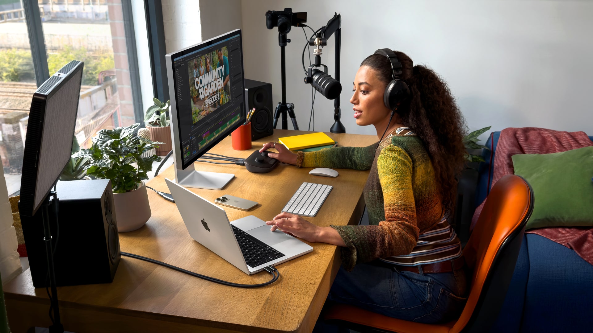 A person using Apple's MacBook Pro M5 laptop.