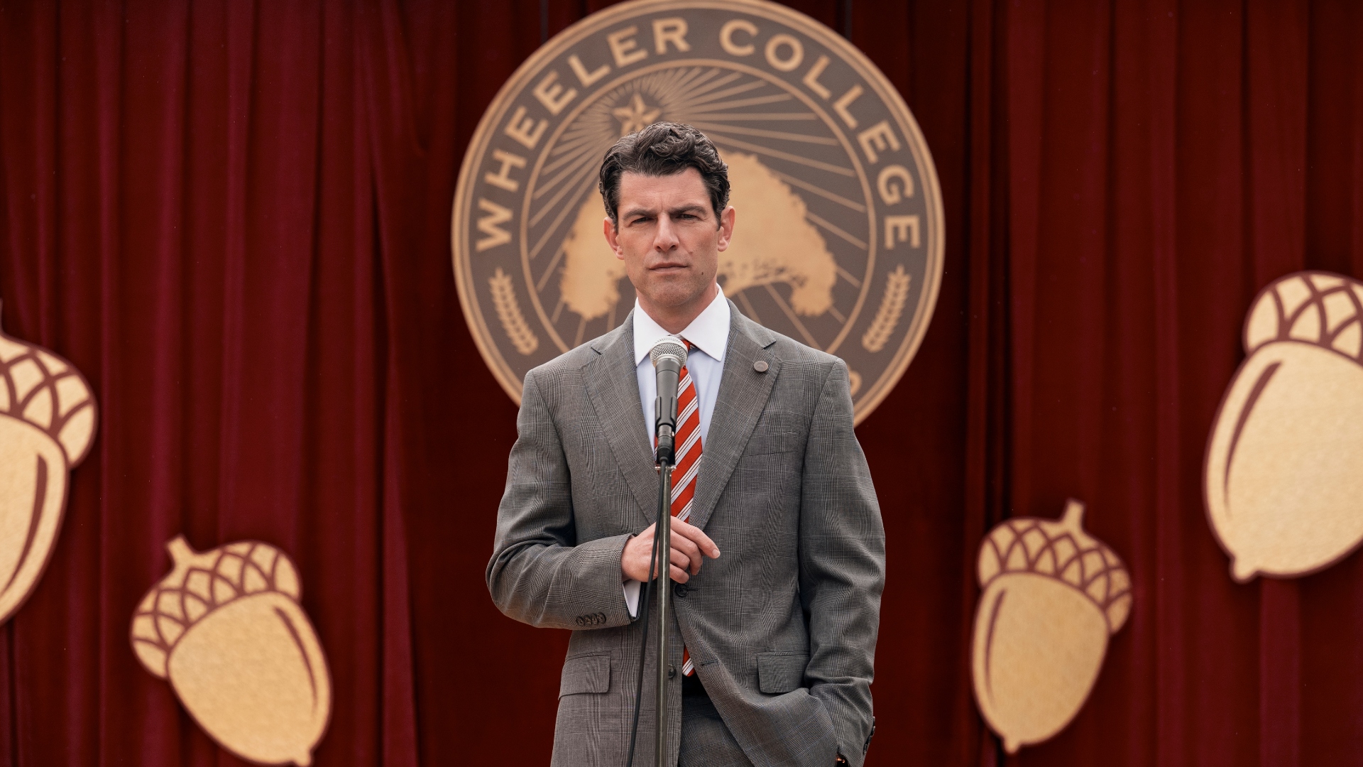 Jack stands in front of a microphone in A Man on the Inside season 2