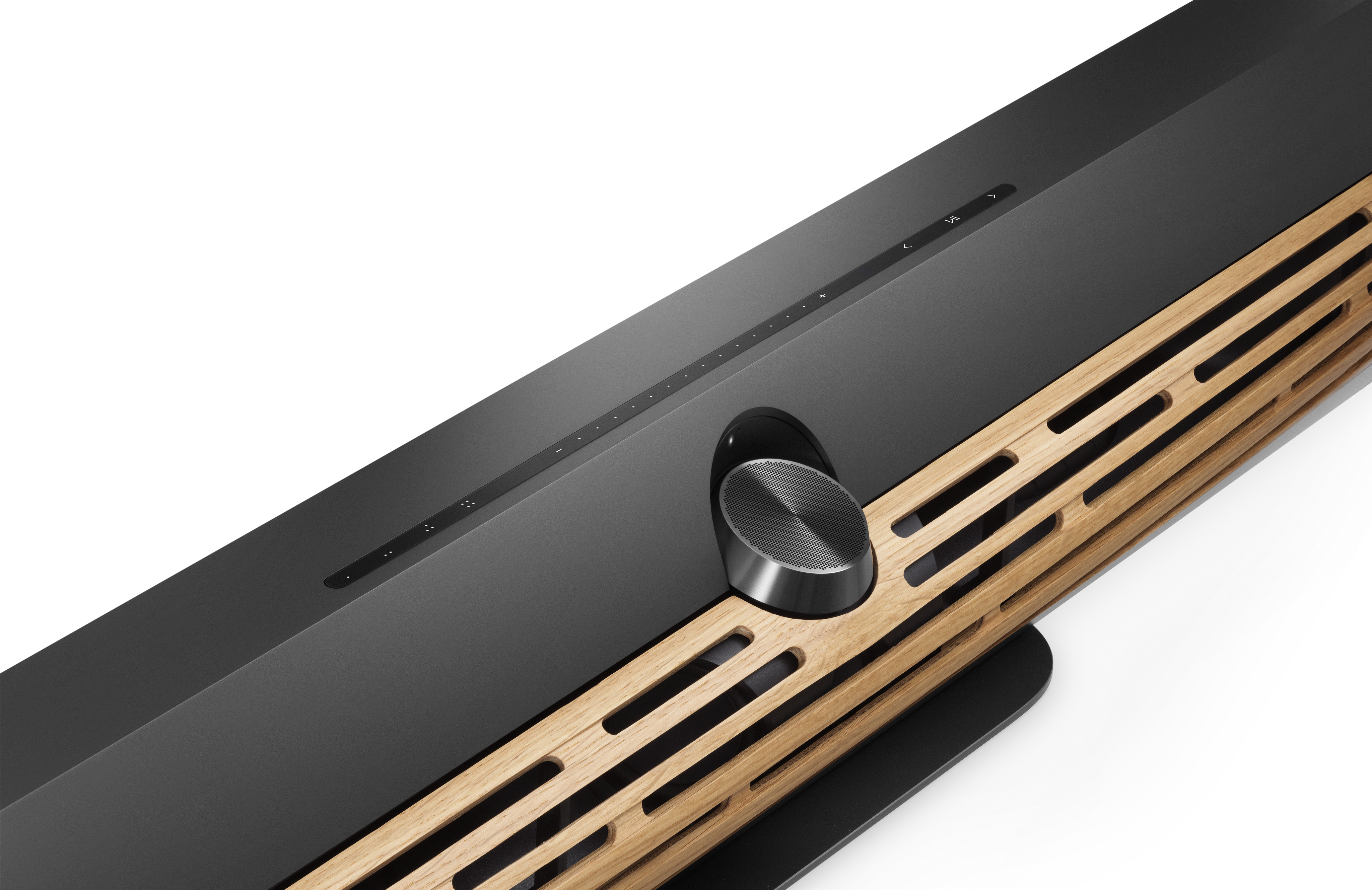 Close-up on the Bang & Olufsen Beosound Premiere in black with wooden grille on white background