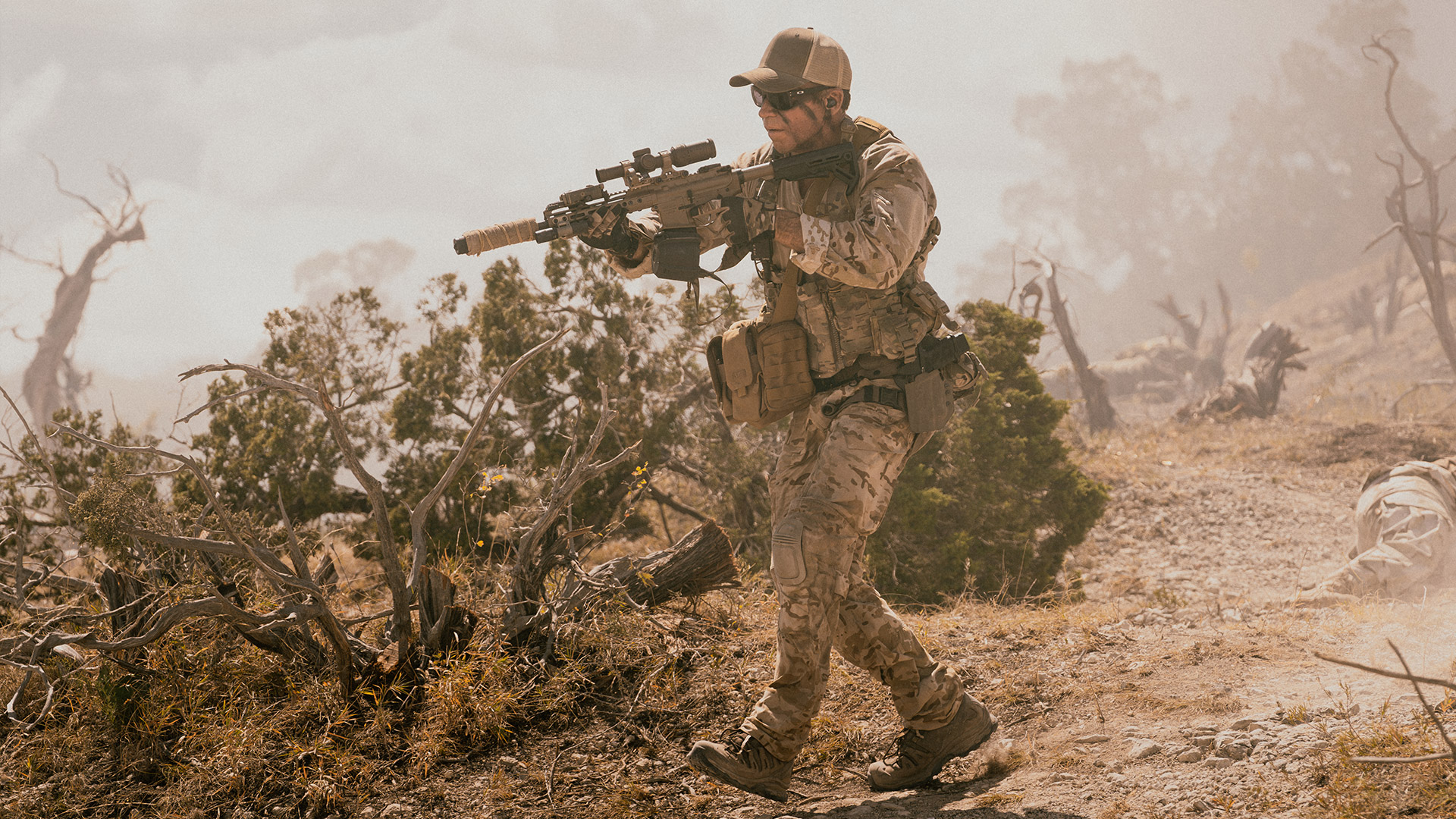 Cody walks with a gun in season 2 of Lioness