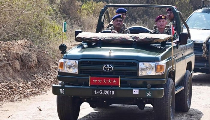 Field Marshal Asim Munir drives with Jordanian King Abdullah during his visit to the Tilla Field shooting ranges. —ISPR