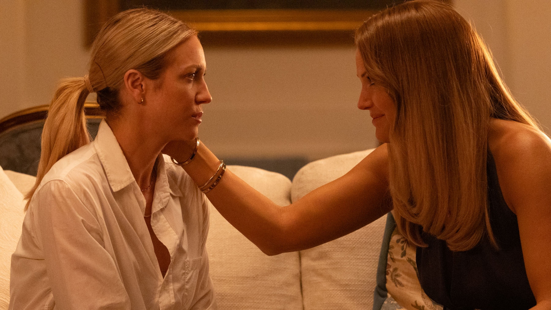 Margo caresses Sophie's cheek in The Hunting Wives