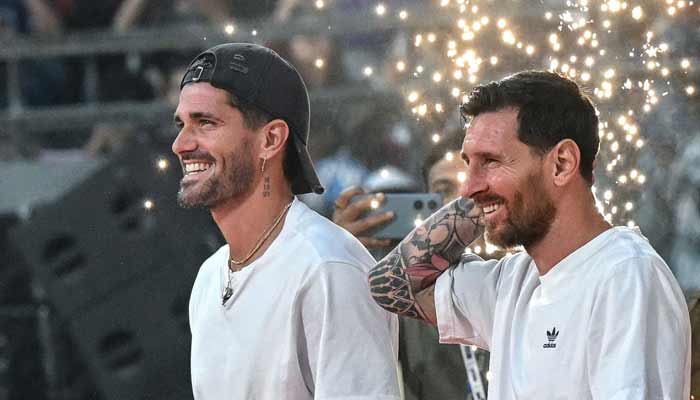 Argentine footballers Lionel Messi (R) and Rodrigo De Paul arrive to attend an event during Messi's GOAT tour at Wankhede Stadium in Mumbai, December 14, 2025. — AFP
