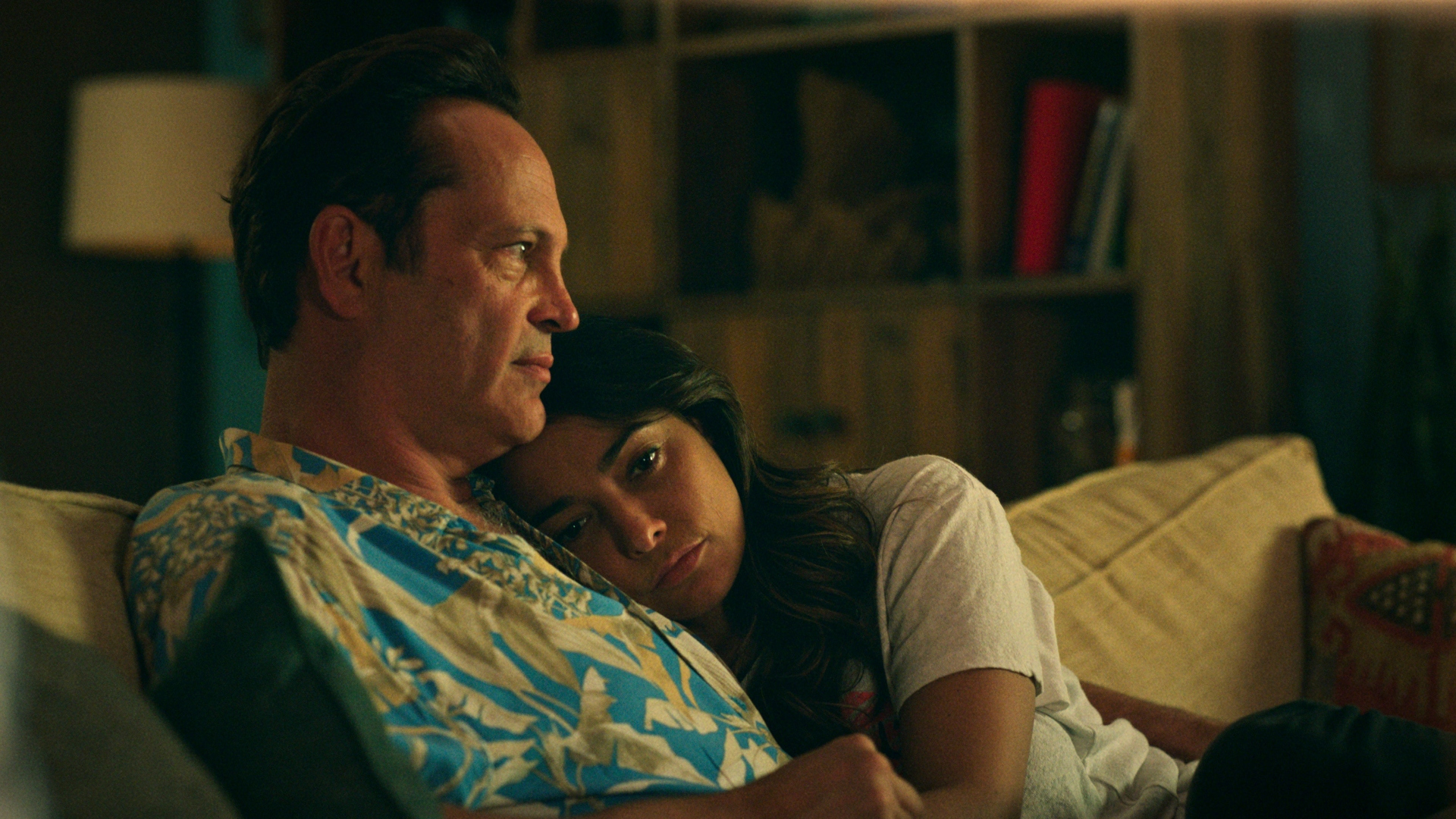 Yancy and Rosa kiss on a couch in Bad Monkey