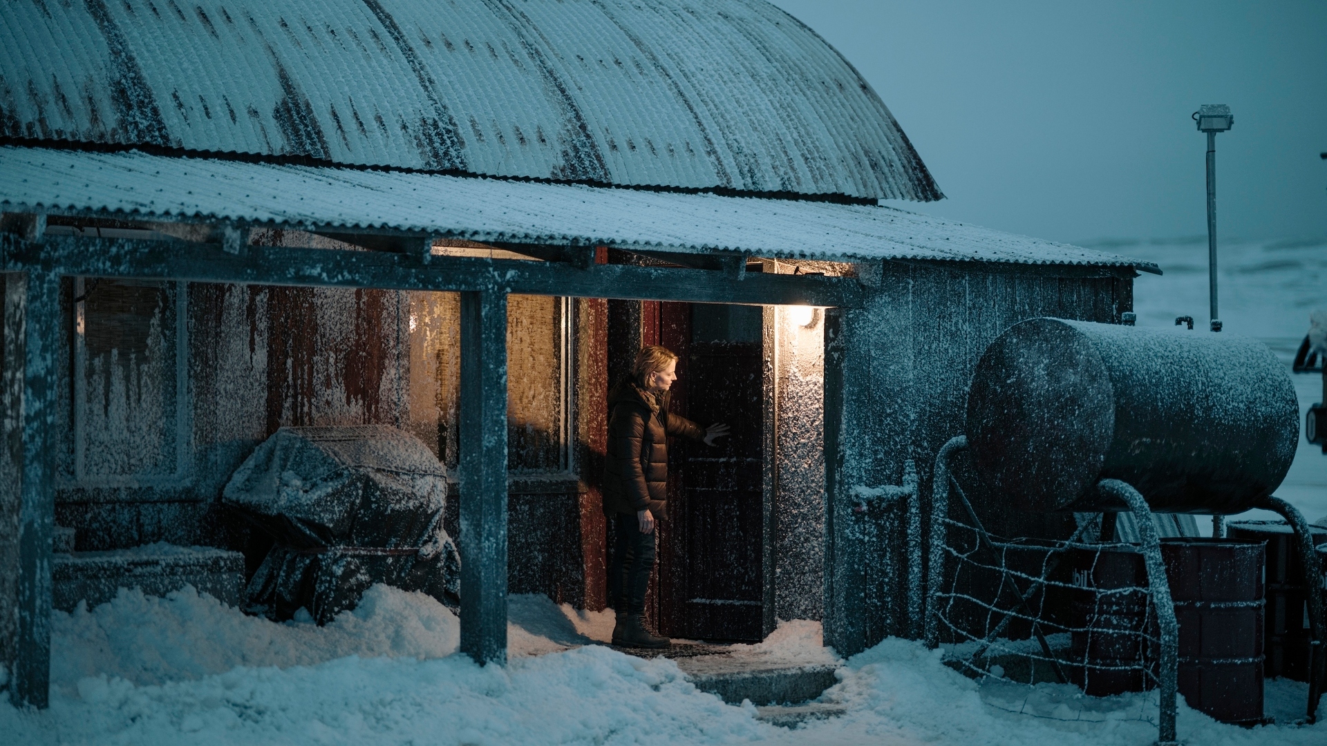 Chief Danvers stands in front of a door in True Detective: Night Country