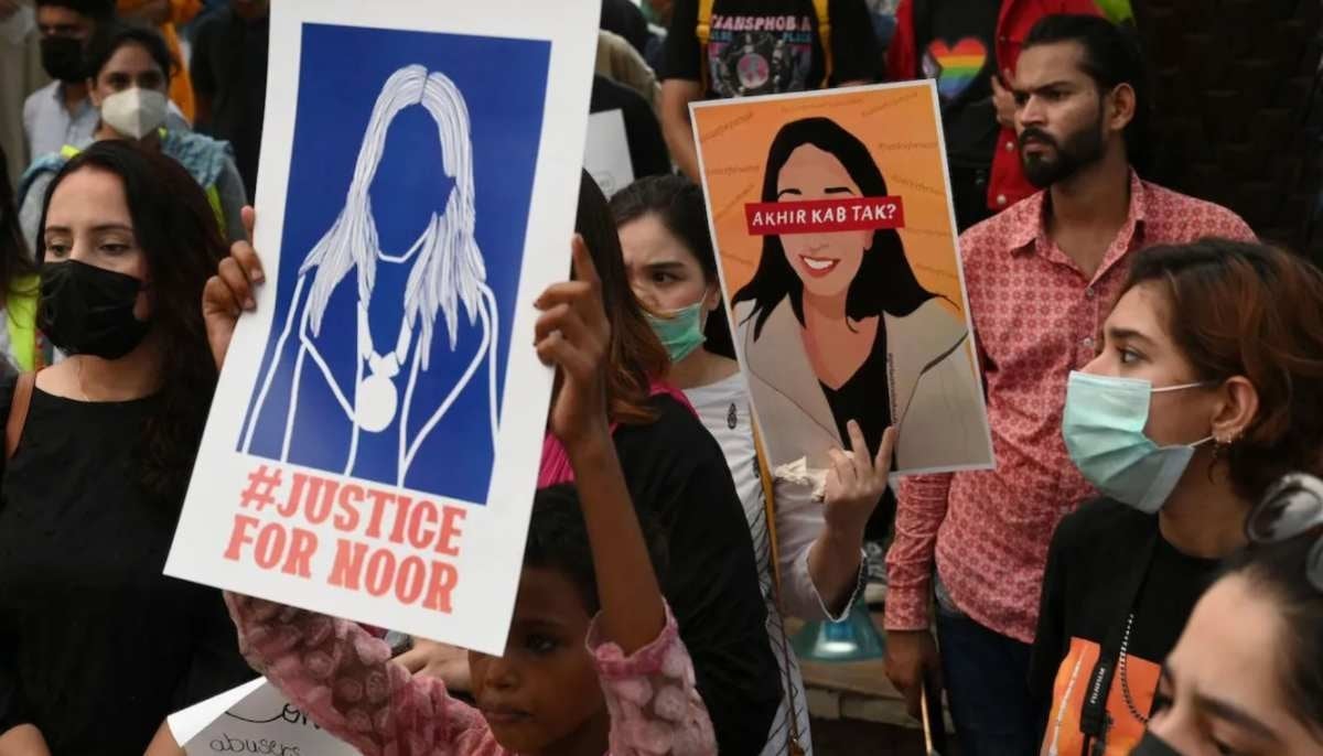 Women's rights activists hold placards during a protest in Lahore on July 24, 2021 against the brutal murder of Noor Mukadam in Islamabad. — AFP/File