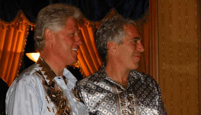 Former US President Bill Clinton stands alongside Jeffrey Epstein in this image released by the Department of Justice in Washington, DC, US, December 19, 2025, as part of a new trove of documents from its investigations into the late financier and convicted sex offender Jeffrey Epstein. -Reuters