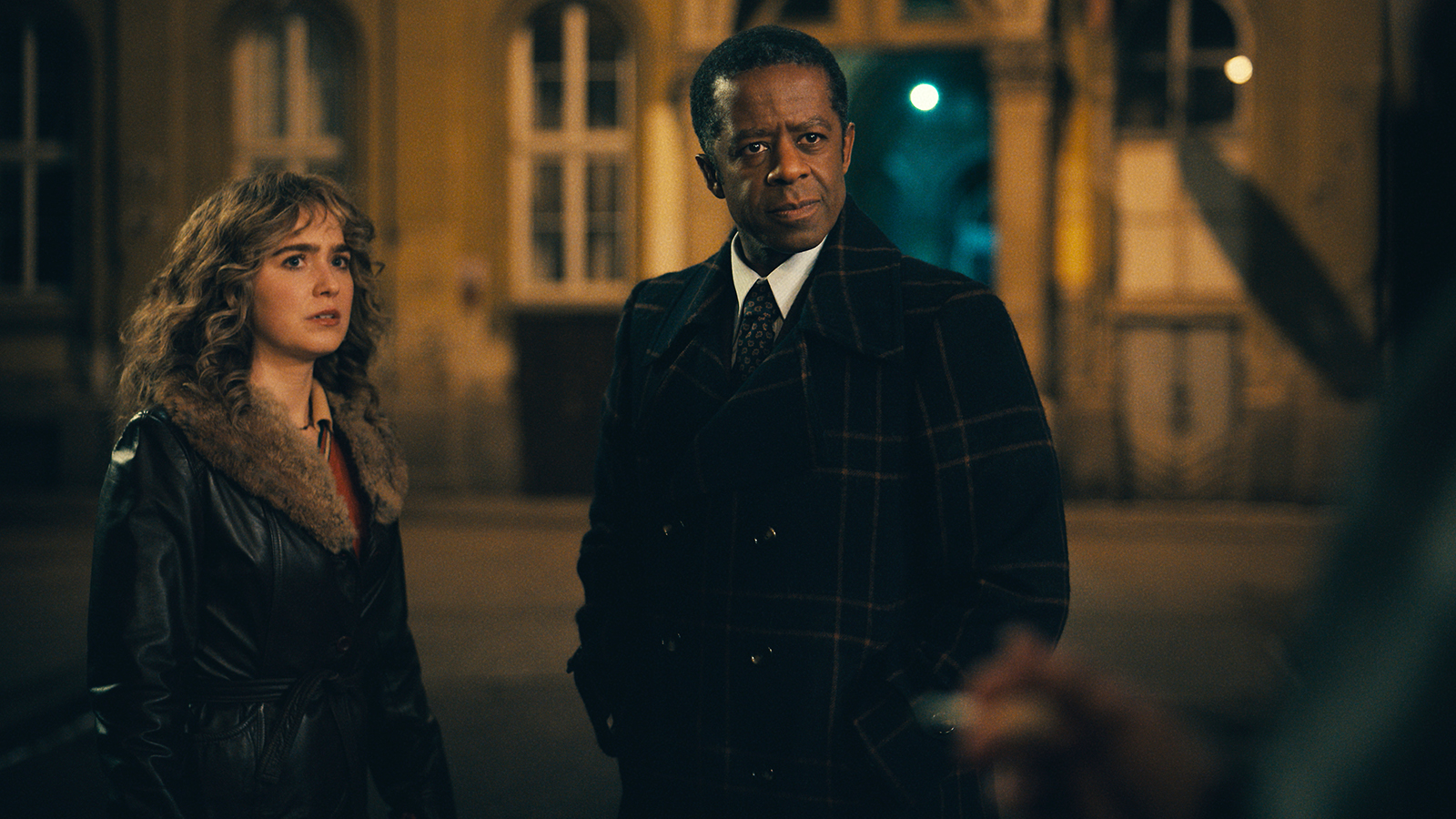 Twila standing next to Dane outside at night in Ponies