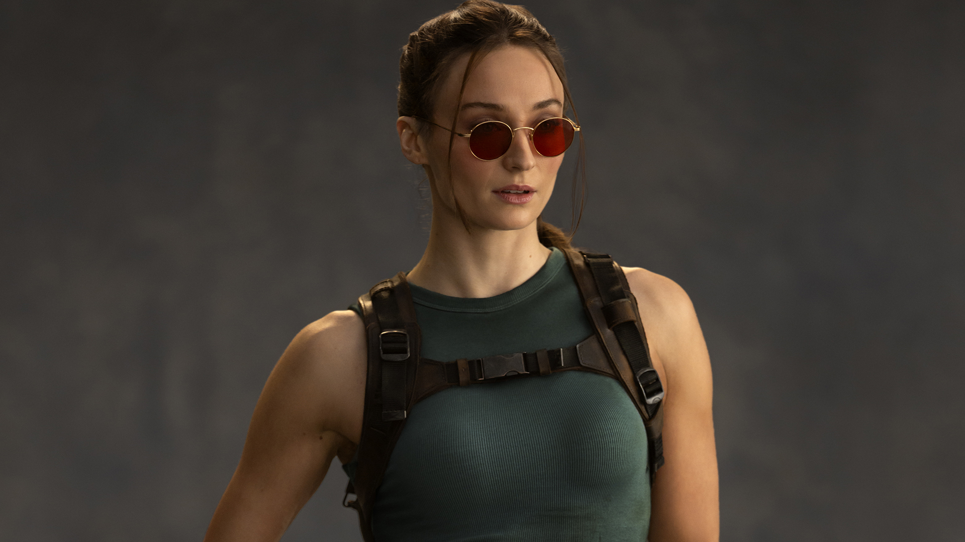 A professional image of Sophie Turner wearing the classic Lara Croft costume in Prime Video's Tomb Raider TV show
