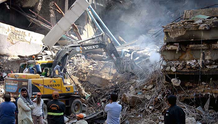View of Gul Plaza after a fire, with heavy machinery and rescue teams operating on MA Jinnah Road, Karachi, January 20, 2026. — PPI