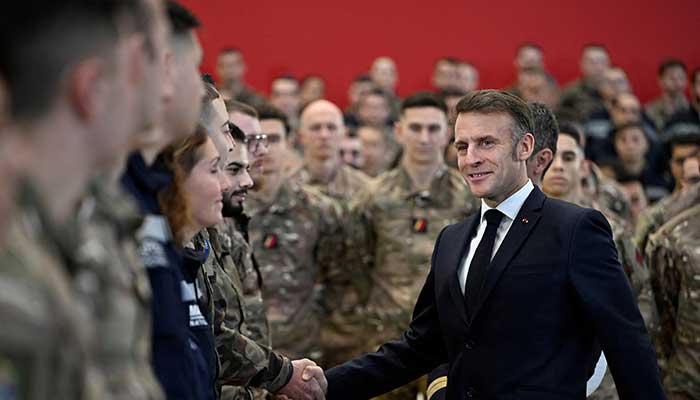 French President Emmanuel Macron shakes hands with soldiers during his visit to the Istres military air base, southern France, January 15, 2026. — Reuters