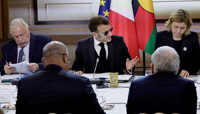 French President Emmanuel Macron, flanked by National Assembly President Yael Braun-Pivet and Senate President Gérard Larcher, gestures as he leads a meeting on New Caledonia at the Elysee Palace in Paris, France, January 19, 2026. — Reuters